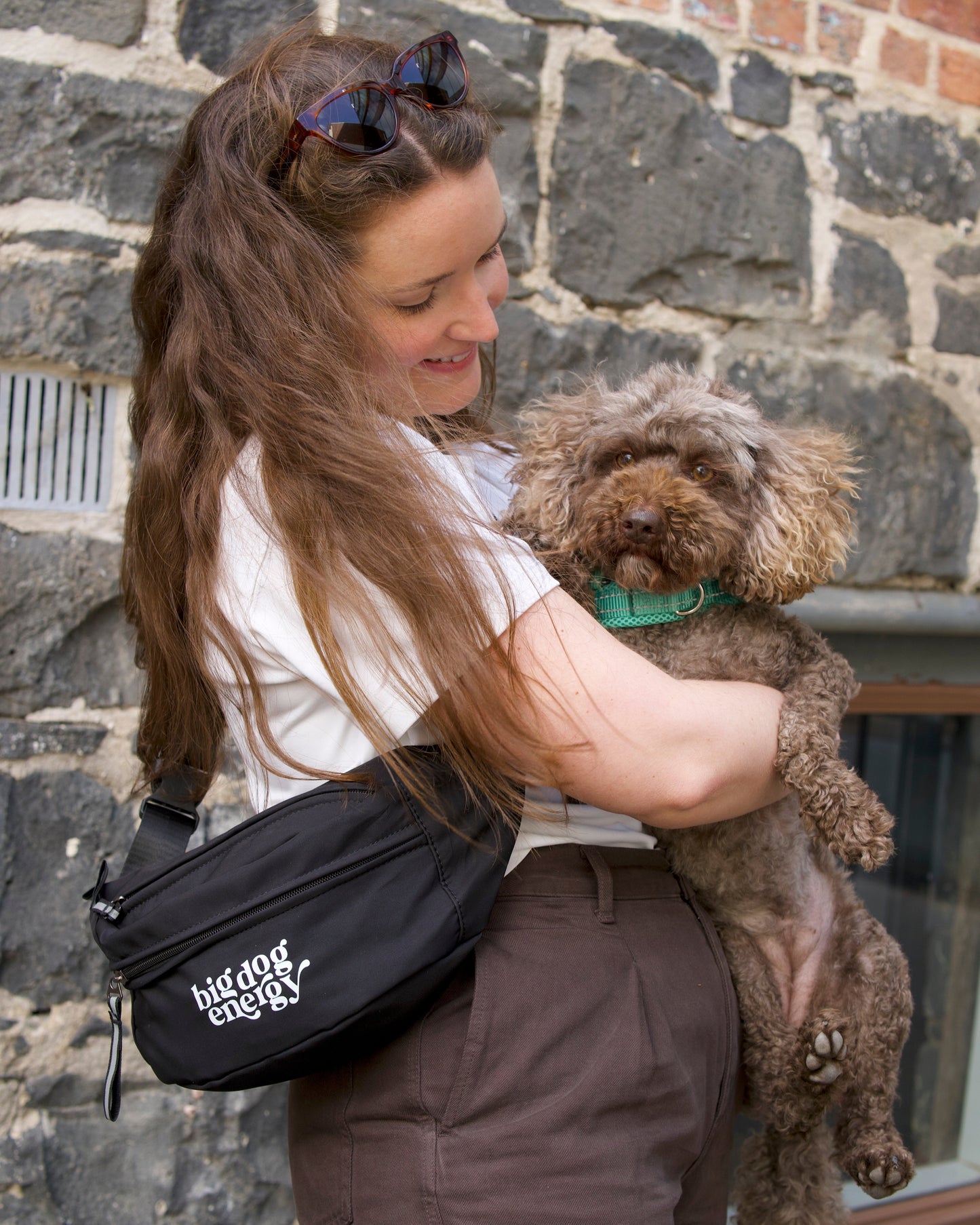 Girl wearing a bumbag and holding a caboodle